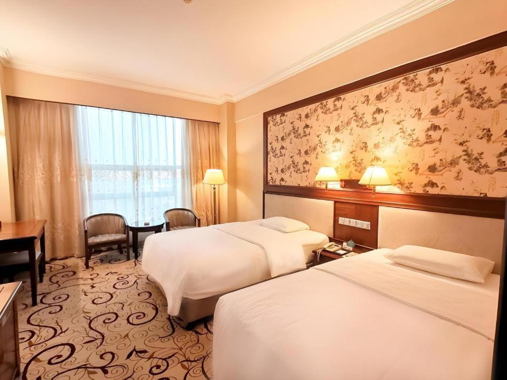 Fenggang Gladden Hotel Tiantangwei Esterno foto